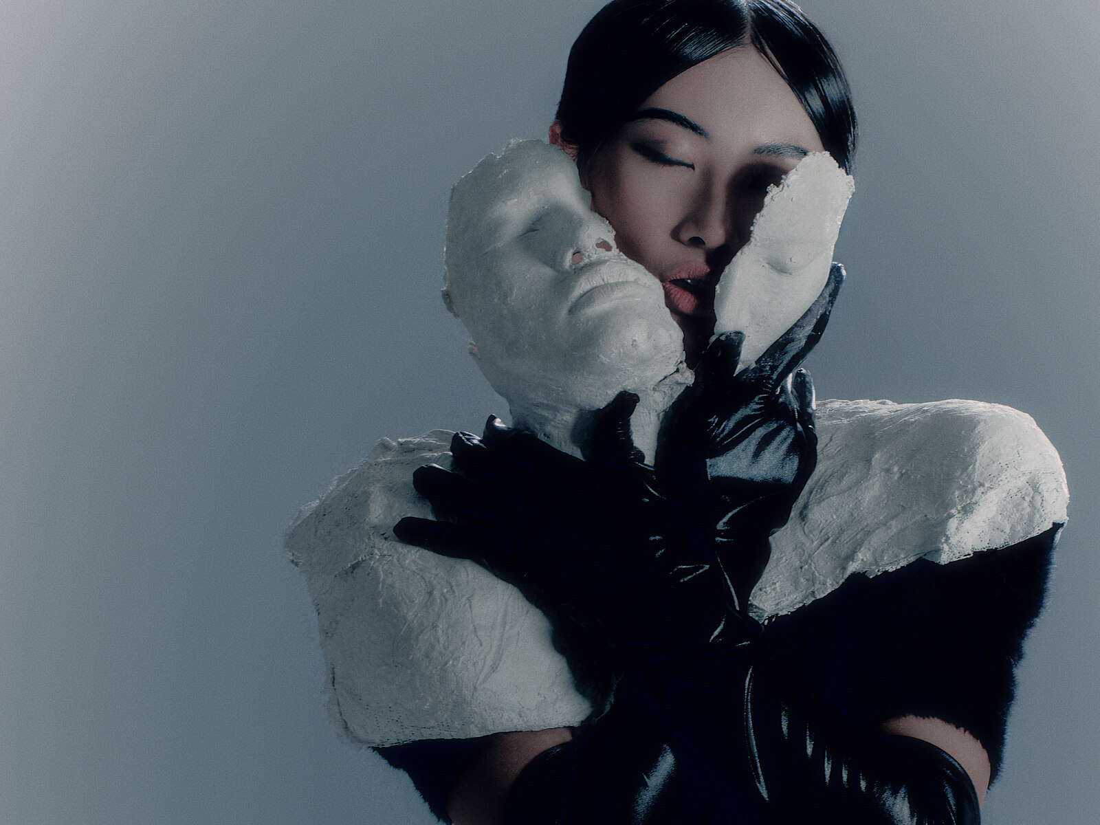 Editorial portrait of Chi Trinh with plaster masks