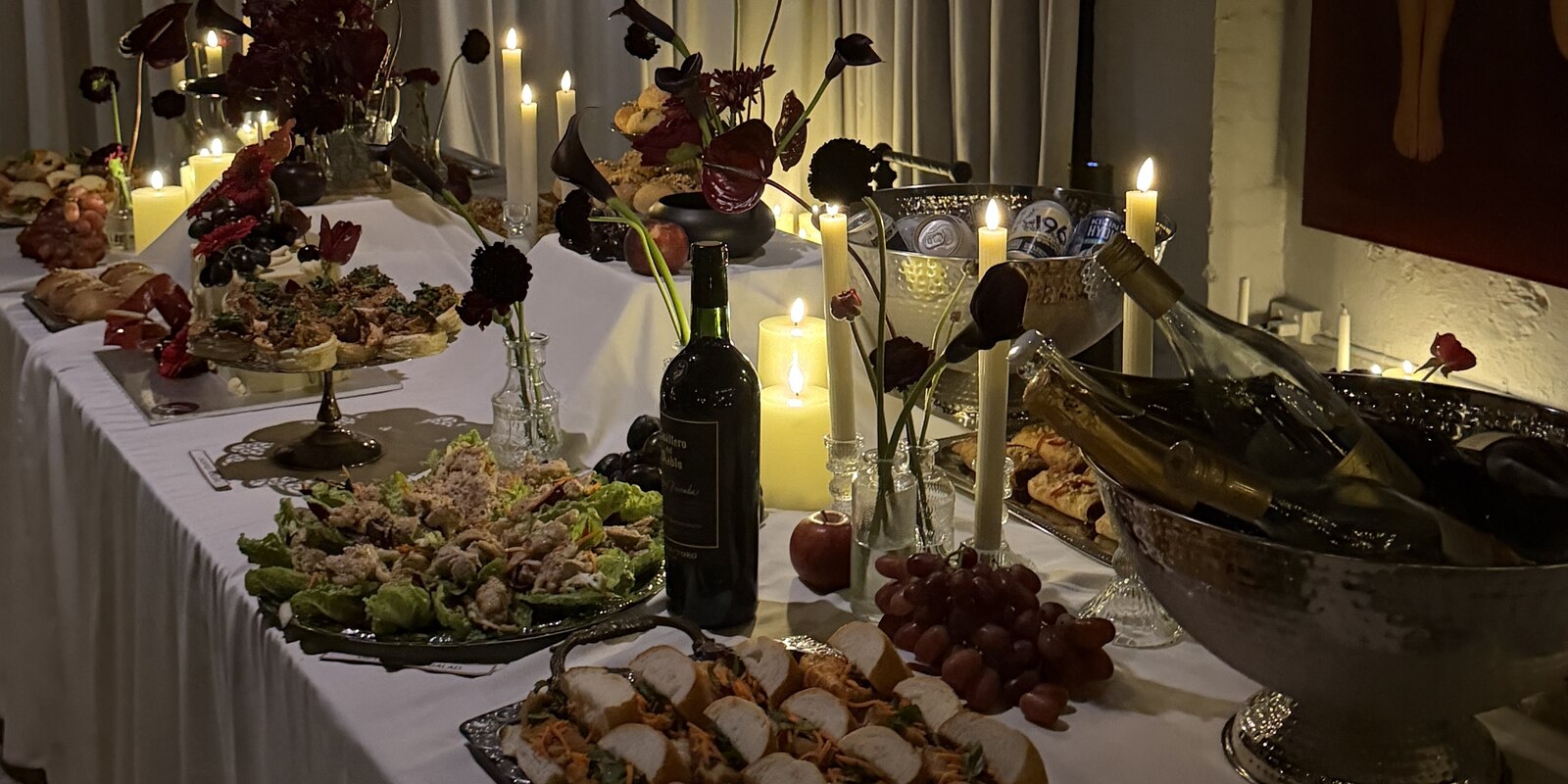 The long table, set by candlelight