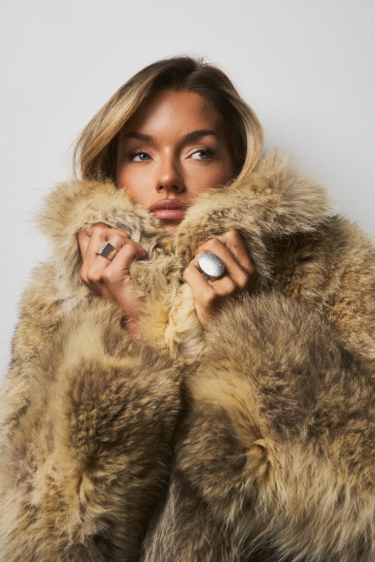 A close beauty portrait in a fur coat