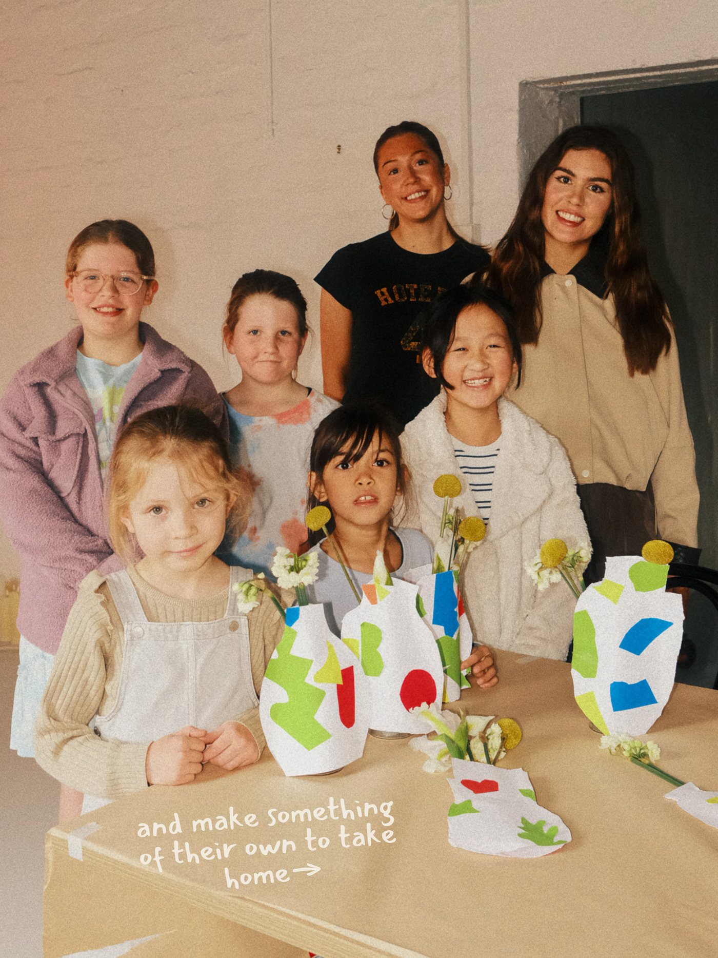 Children at the end of a Sunday session holding the work they made