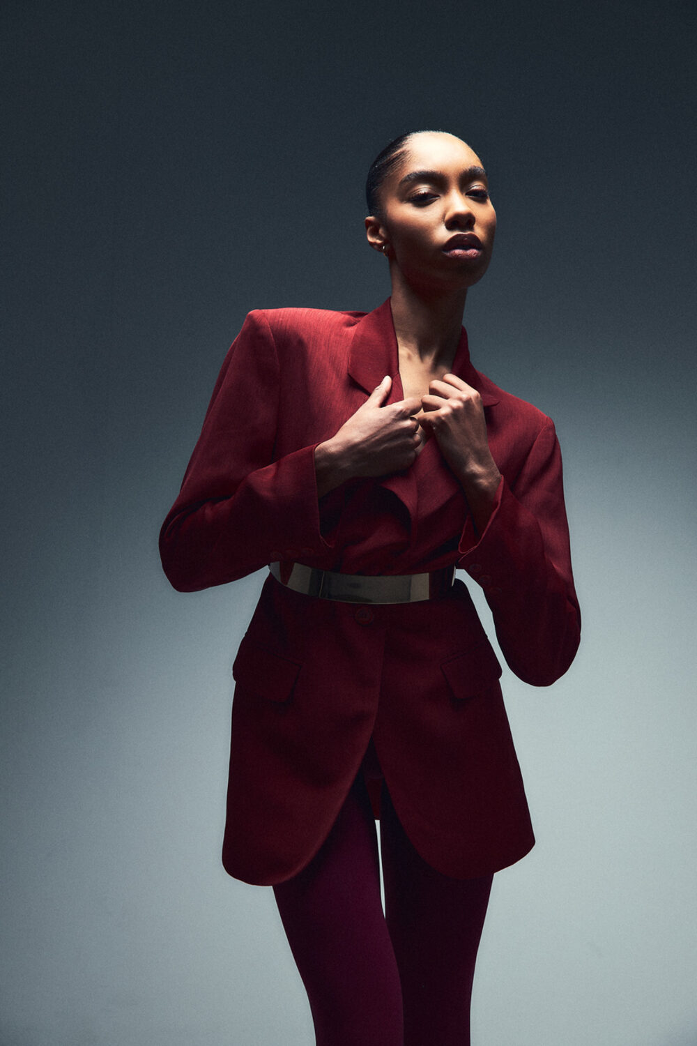 A portrait in a red suit, shot under studio lighting at La Vita Nova